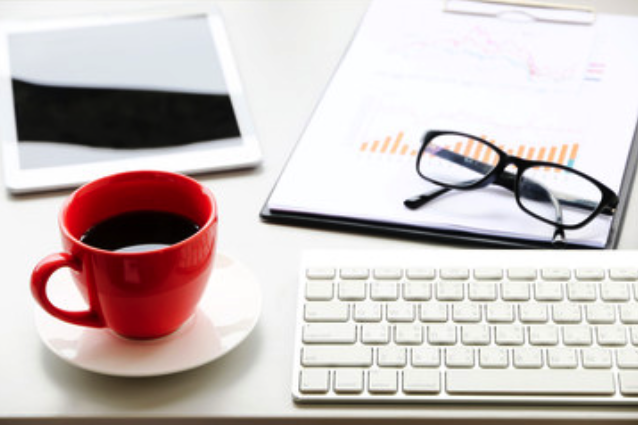 red mug and computer